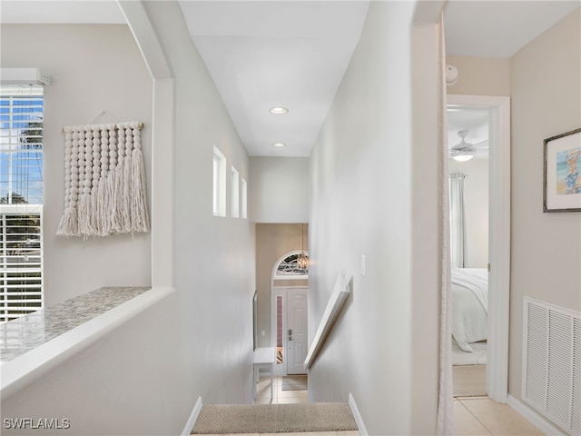 staircase featuring tile patterned floors