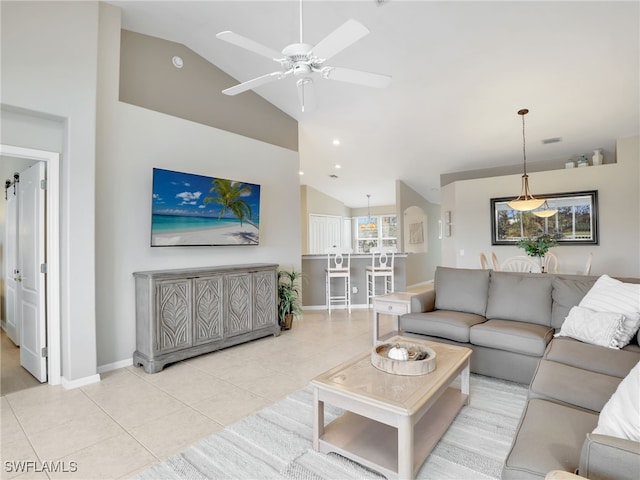 tiled living room with high vaulted ceiling and ceiling fan