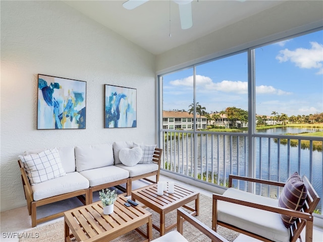 sunroom with a water view, ceiling fan, and lofted ceiling