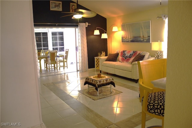 living room featuring tile patterned floors and ceiling fan