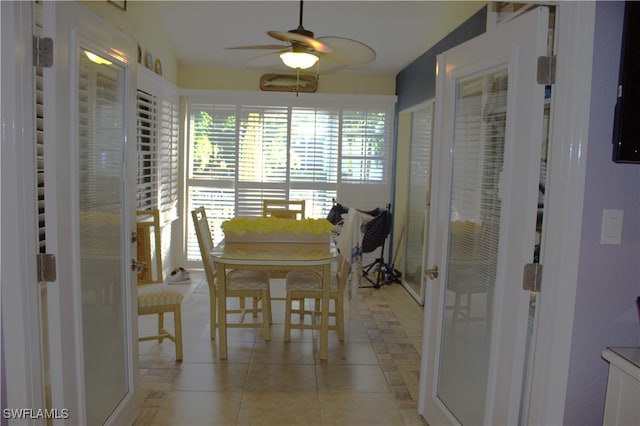 dining area featuring ceiling fan and light tile patterned floors