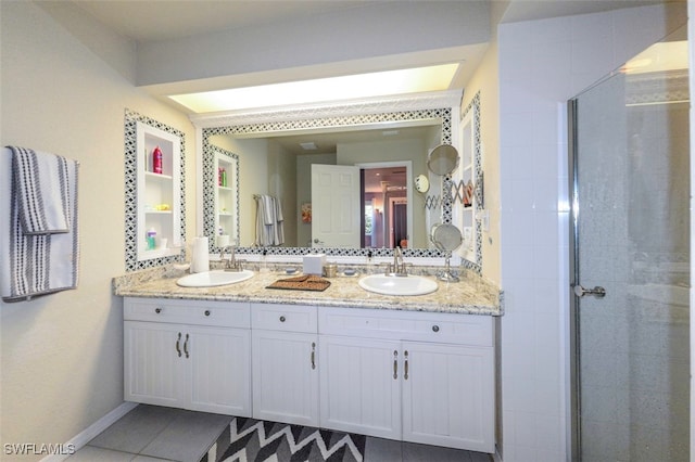 bathroom featuring walk in shower, tile patterned floors, and vanity