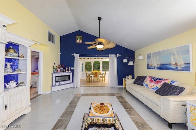 tiled living room featuring lofted ceiling and ceiling fan