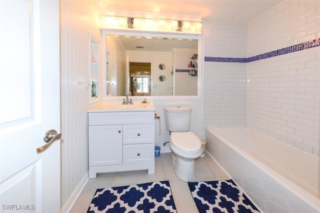 full bathroom with vanity, tiled shower / bath, tile patterned floors, and toilet