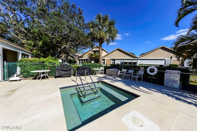 view of swimming pool with a patio area