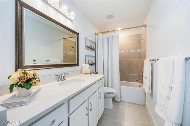 full bathroom featuring vanity, tile patterned floors, toilet, and shower / bath combo