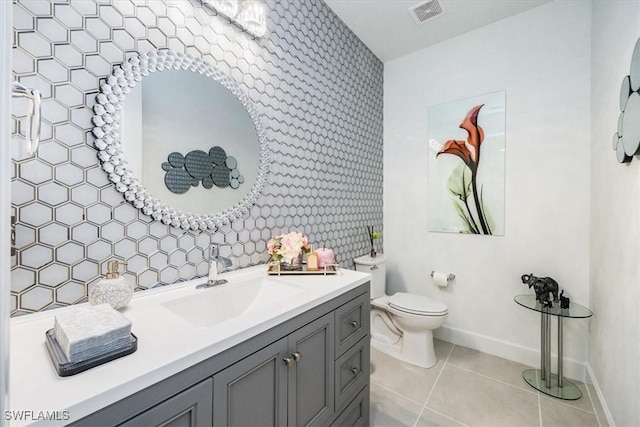 bathroom with tile patterned floors, toilet, and vanity