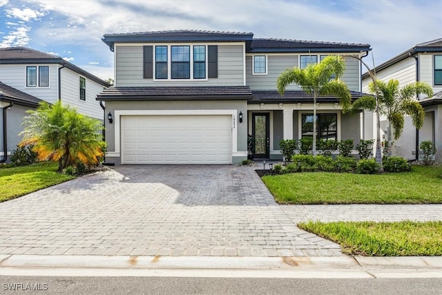 view of front facade featuring a garage and a front yard