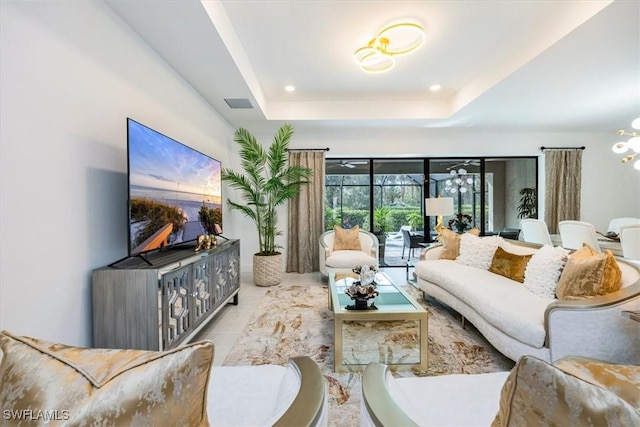 tiled living room featuring a raised ceiling