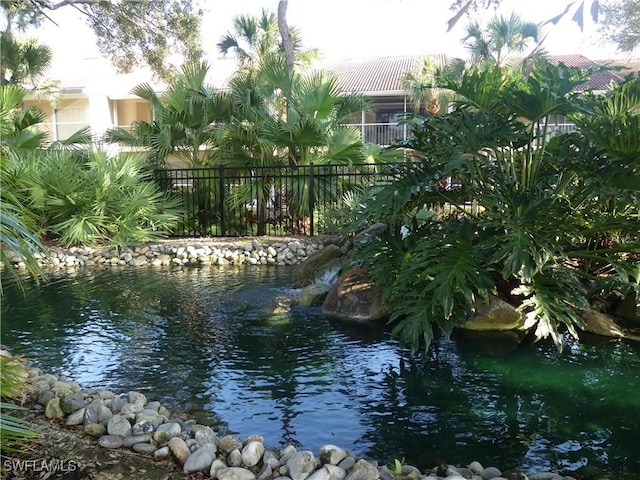 water view featuring a garden pond