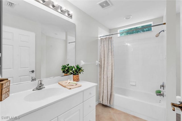 bathroom with tile patterned flooring, vanity, and shower / tub combo with curtain