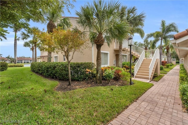 2365 Hidden Lake Ct Unit 8001, Naples, FL 34112 - view of property's community featuring a lawn and stairway