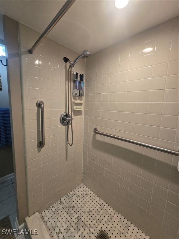 bathroom with tiled shower