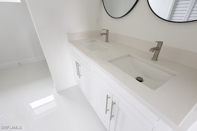 bathroom featuring vanity and tile patterned flooring