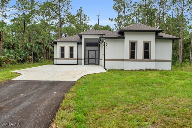 prairie-style house featuring a front yard