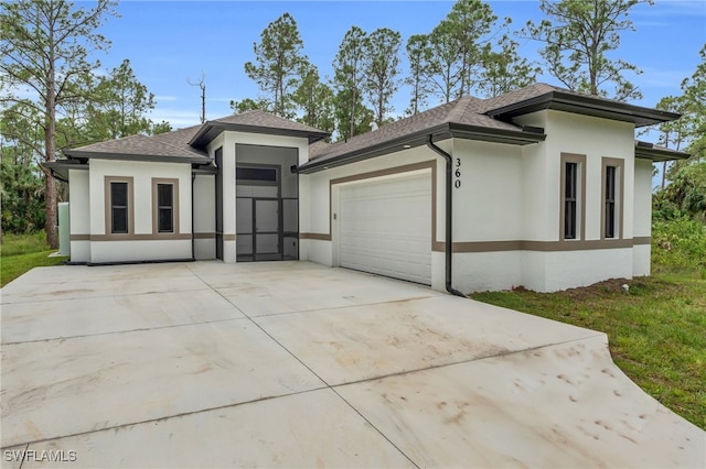 prairie-style house featuring a garage