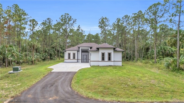 mediterranean / spanish-style home with a front lawn