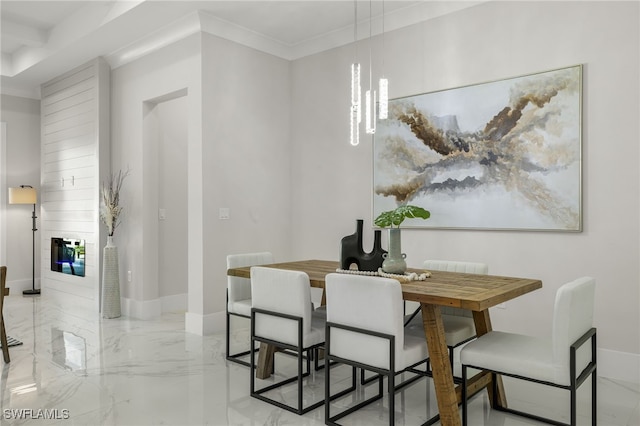 dining room featuring crown molding