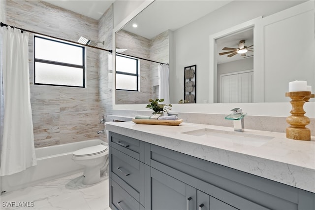 full bathroom featuring vanity, toilet, shower / bath combo, and ceiling fan