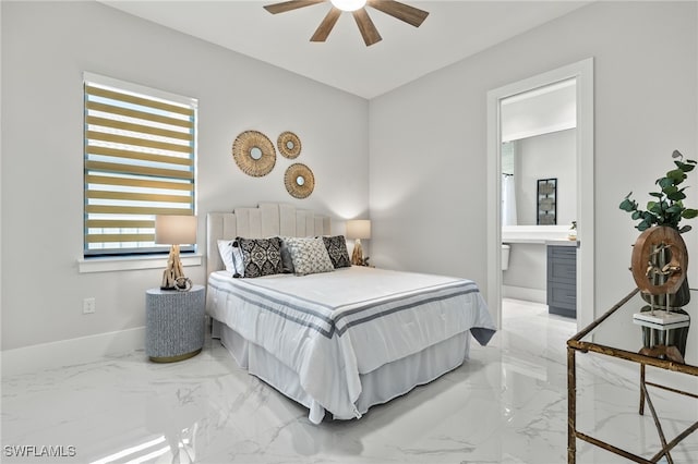 bedroom with ceiling fan, multiple windows, and ensuite bath