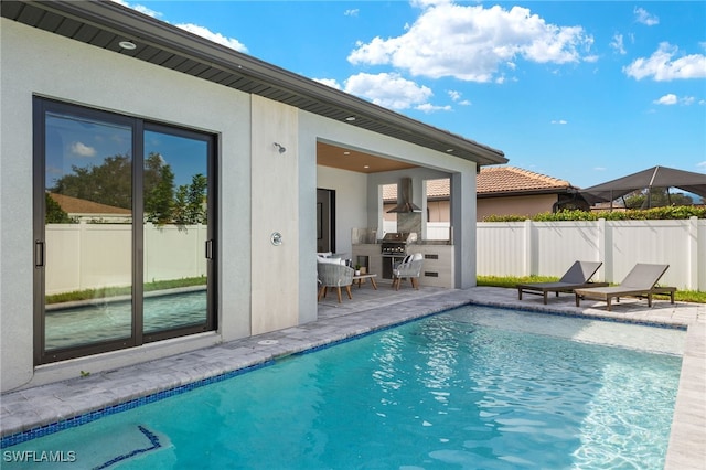 view of pool with a patio area and a grill