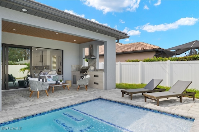 view of swimming pool featuring area for grilling and a patio area