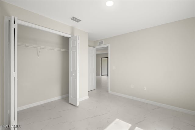 unfurnished bedroom featuring a closet