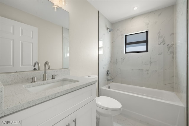 full bathroom featuring toilet, tiled shower / bath combo, and vanity