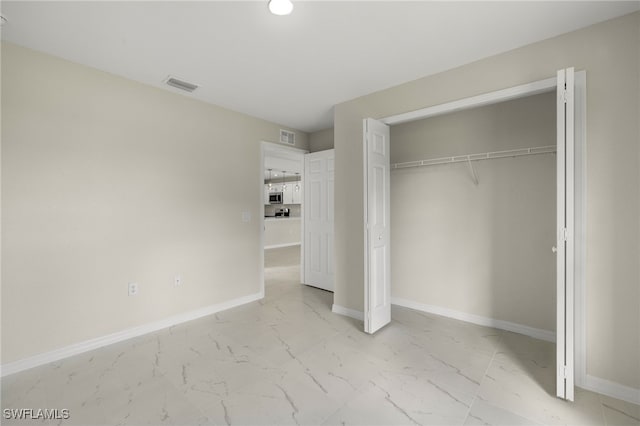 unfurnished bedroom with a closet