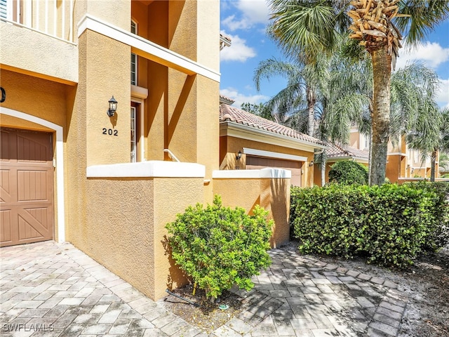 doorway to property featuring a garage