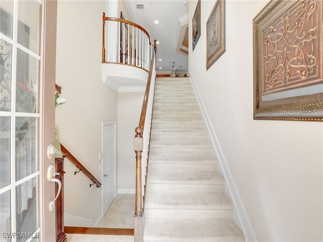 stairs with tile patterned floors