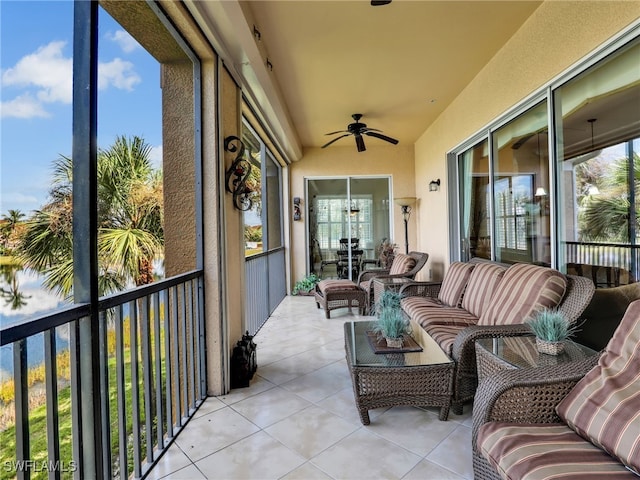 sunroom / solarium with ceiling fan and a wealth of natural light