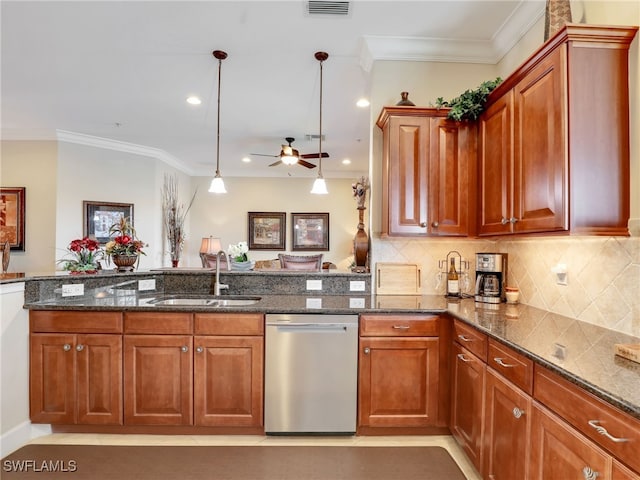 kitchen with hanging light fixtures, sink, dishwasher, dark stone countertops, and crown molding