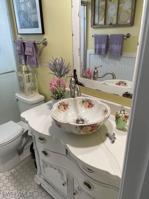 bathroom with vanity and toilet