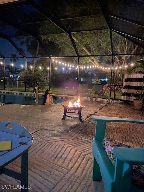 view of community featuring a patio and a fire pit