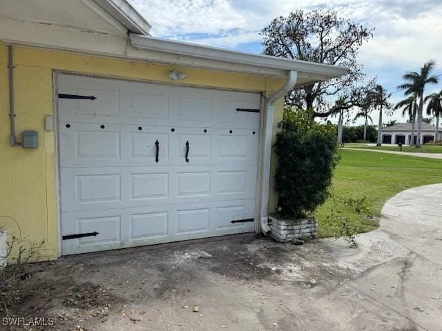 garage with a yard