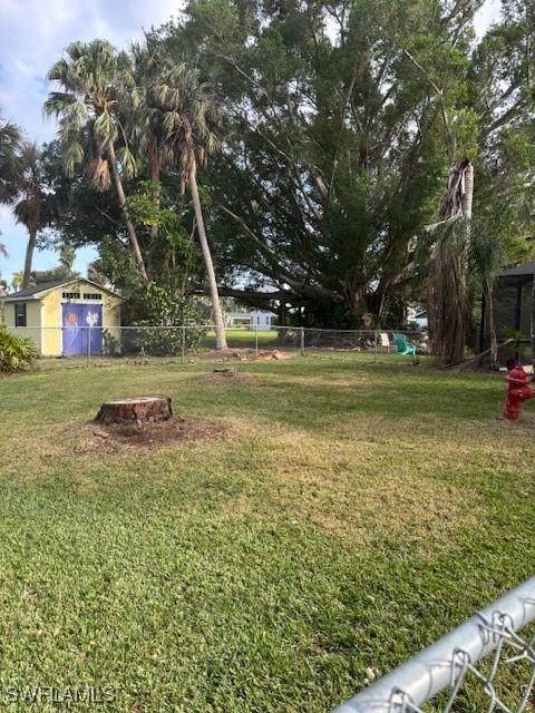 view of yard with an outdoor fire pit