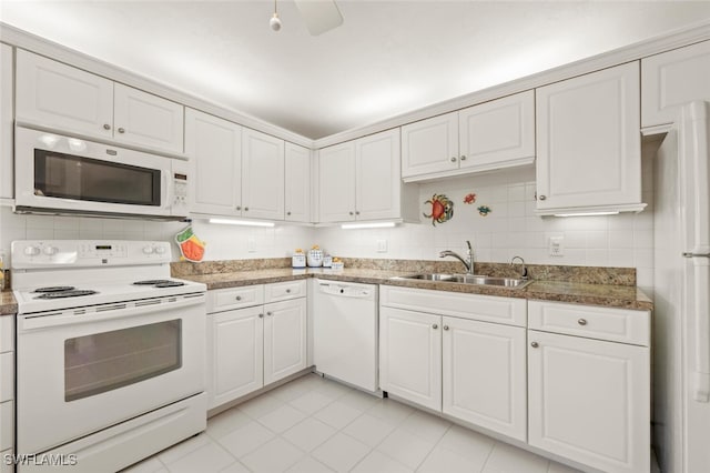 kitchen featuring white cabinetry, sink, white appliances, decorative backsplash, and light tile patterned floors