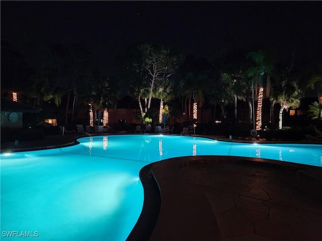 view of pool at night