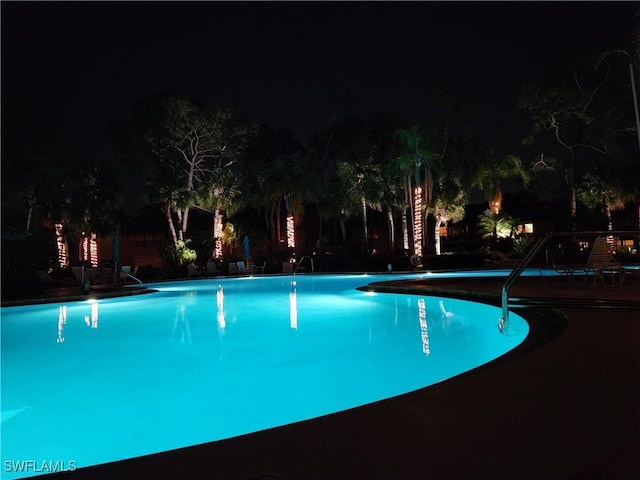 view of pool at night