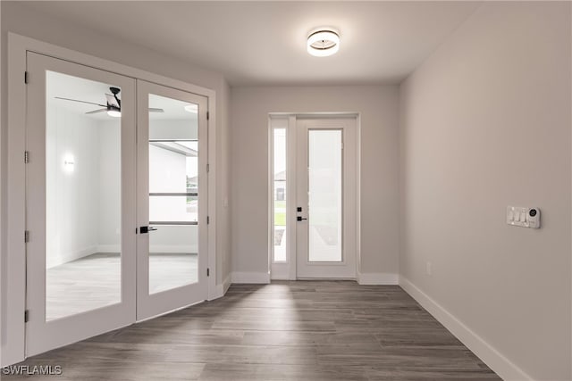 entryway with french doors, dark hardwood / wood-style flooring, and ceiling fan