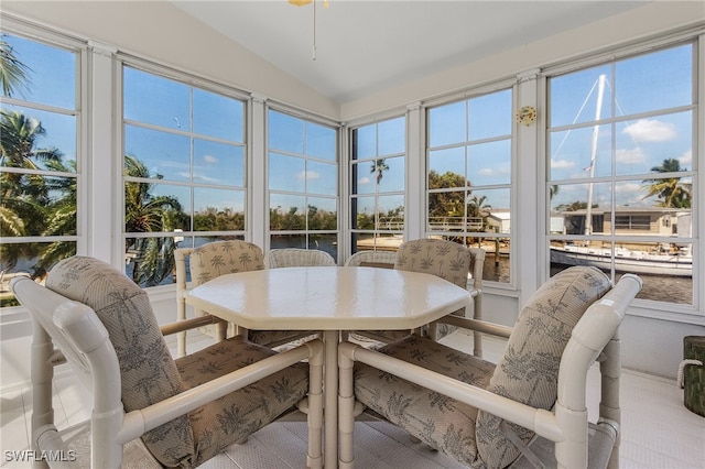 sunroom / solarium featuring lofted ceiling