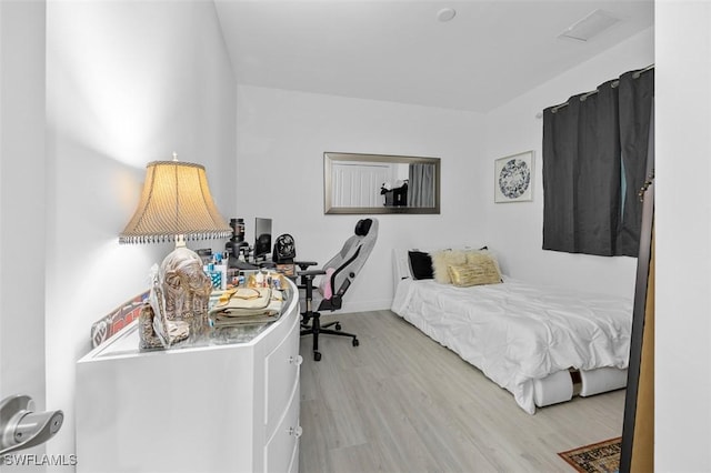 bedroom featuring light hardwood / wood-style floors