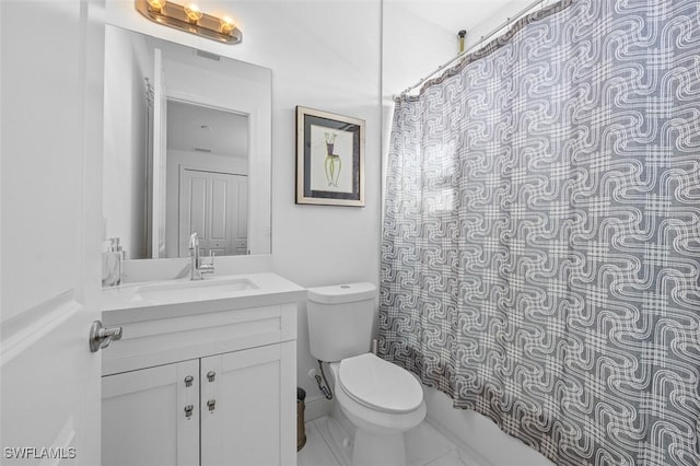 bathroom featuring vanity, curtained shower, and toilet