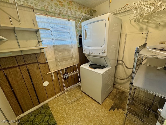 laundry room featuring stacked washer and dryer