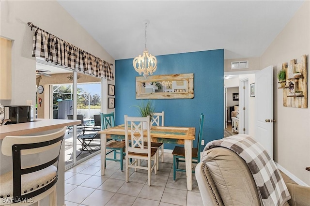 7417 S Blue Sage, Punta Gorda, FL 33955 - dining space with vaulted ceiling, a chandelier, light tile patterned floors, and baseboards