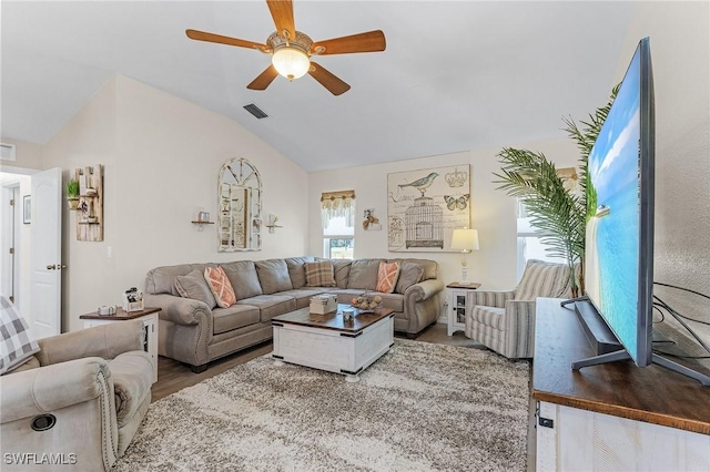 7417 S Blue Sage, Punta Gorda, FL 33955 - living area with vaulted ceiling, a ceiling fan, and wood finished floors