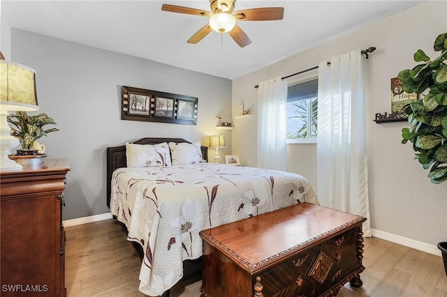 bedroom with hardwood / wood-style flooring and ceiling fan