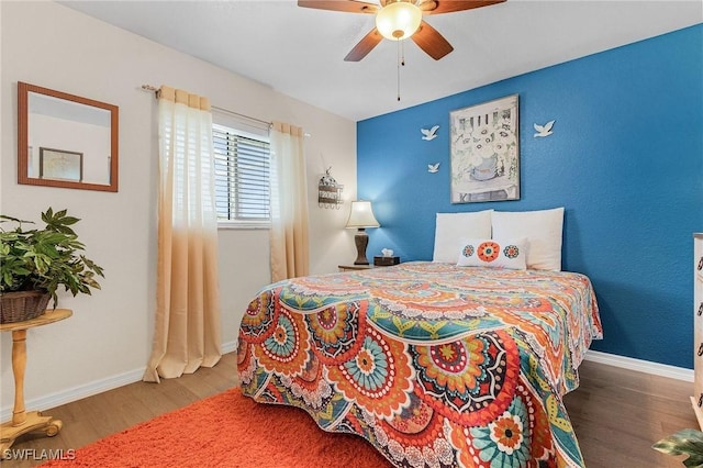 bedroom with ceiling fan and wood-type flooring