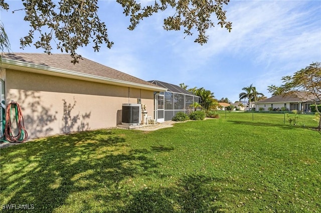 7417 S Blue Sage, Punta Gorda, FL 33955 - view of yard with central AC unit and a lanai